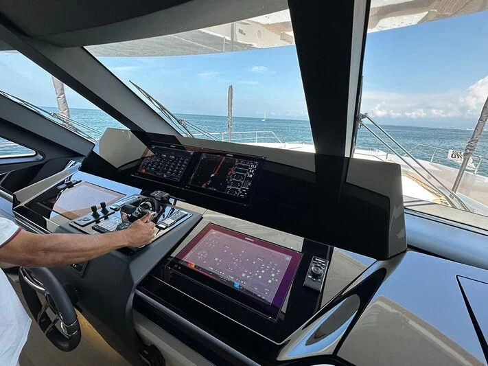 a person driving a car aboard EYE OF DESTINY Yacht for Sale