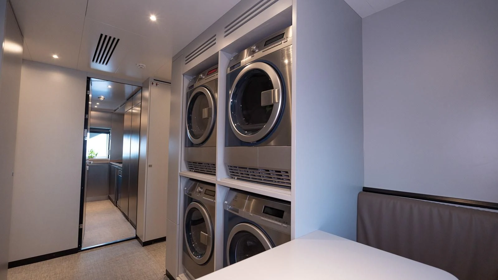 a room with a washing machine and a washer aboard EYE OF DESTINY Yacht for Sale