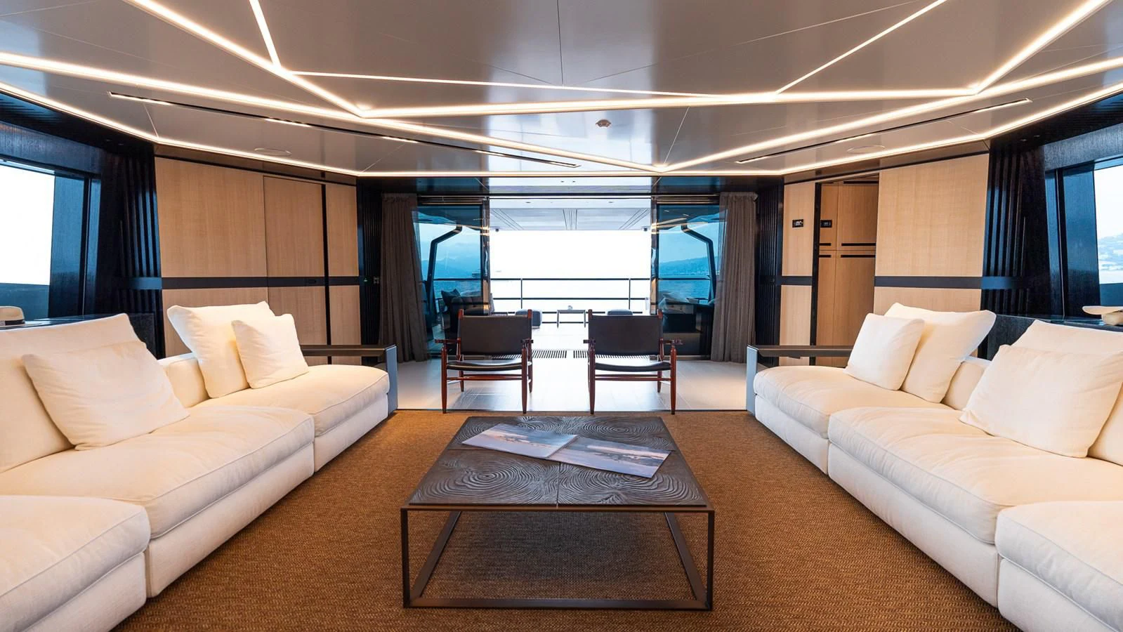 a living room with a large window aboard EYE OF DESTINY Yacht for Sale