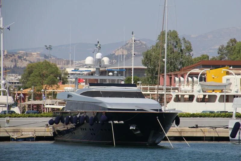 boats docked at a pier aboard BOLARO Yacht for Sale