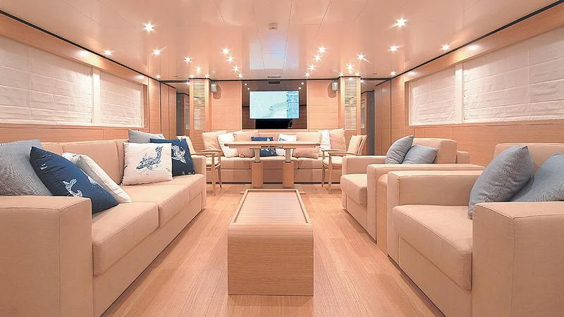 a living room with a couch and a tv aboard BOLARO Yacht for Sale