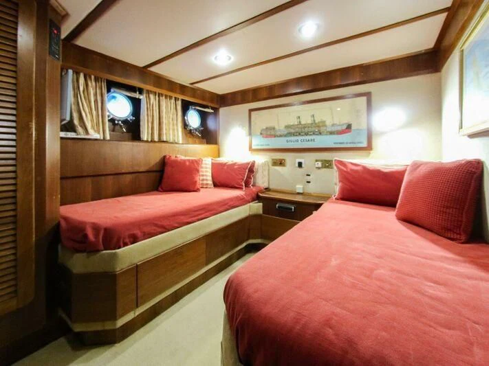 a couple of beds in a hotel room aboard LA GRANDE DAME Yacht for Sale