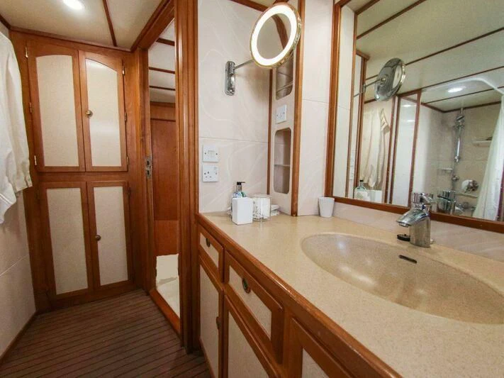 a bathroom with a sink and a mirror aboard LA GRANDE DAME Yacht for Sale