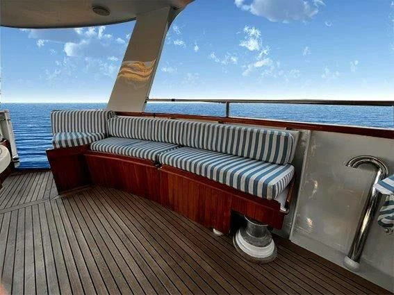 a couch on a deck aboard LA GRANDE DAME Yacht for Sale