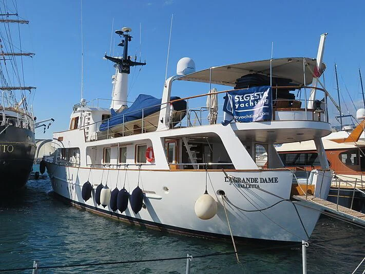 a boat docked at a pier aboard LA GRANDE DAME Yacht for Sale