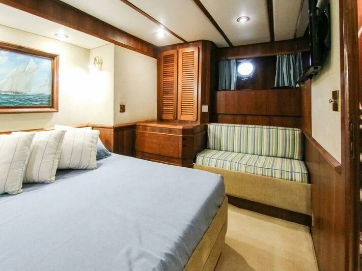 a room with a bed and a couch aboard LA GRANDE DAME Yacht for Sale