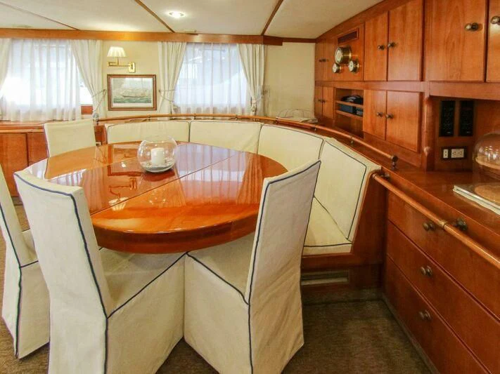 a kitchen with wooden cabinets aboard LA GRANDE DAME Yacht for Sale