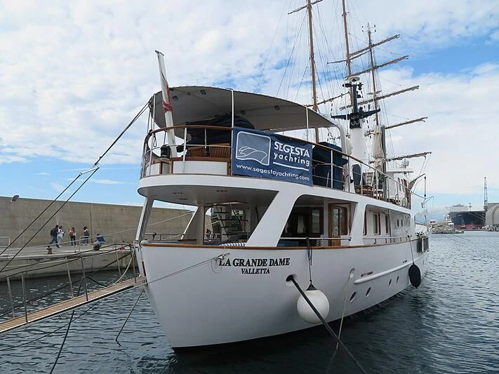 a boat docked at a pier aboard LA GRANDE DAME Yacht for Sale