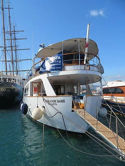 a boat docked at a pier aboard LA GRANDE DAME Yacht for Sale