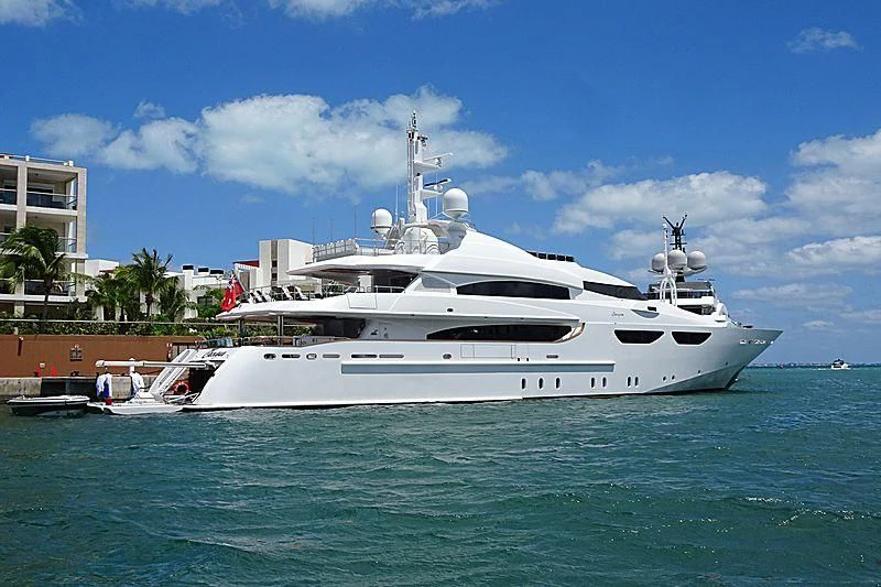 a white yacht in the water aboard CACIQUE Yacht for Sale