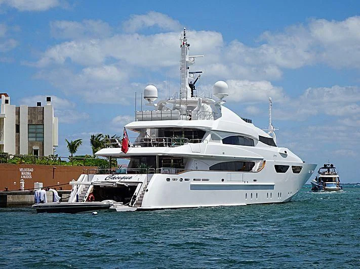 a large white boat in the water aboard CACIQUE Yacht for Sale