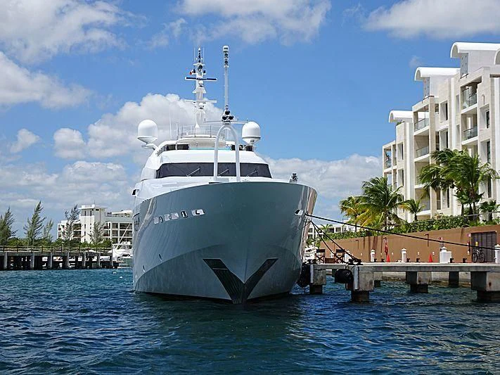 a large white boat in the water aboard CACIQUE Yacht for Sale