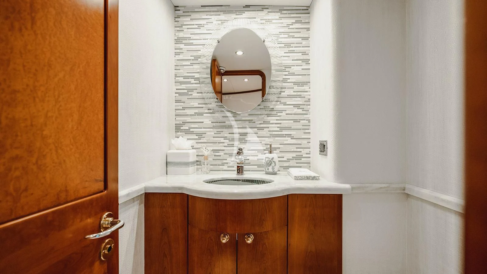 a bathroom with a mirror aboard LA LADY Yacht for Sale