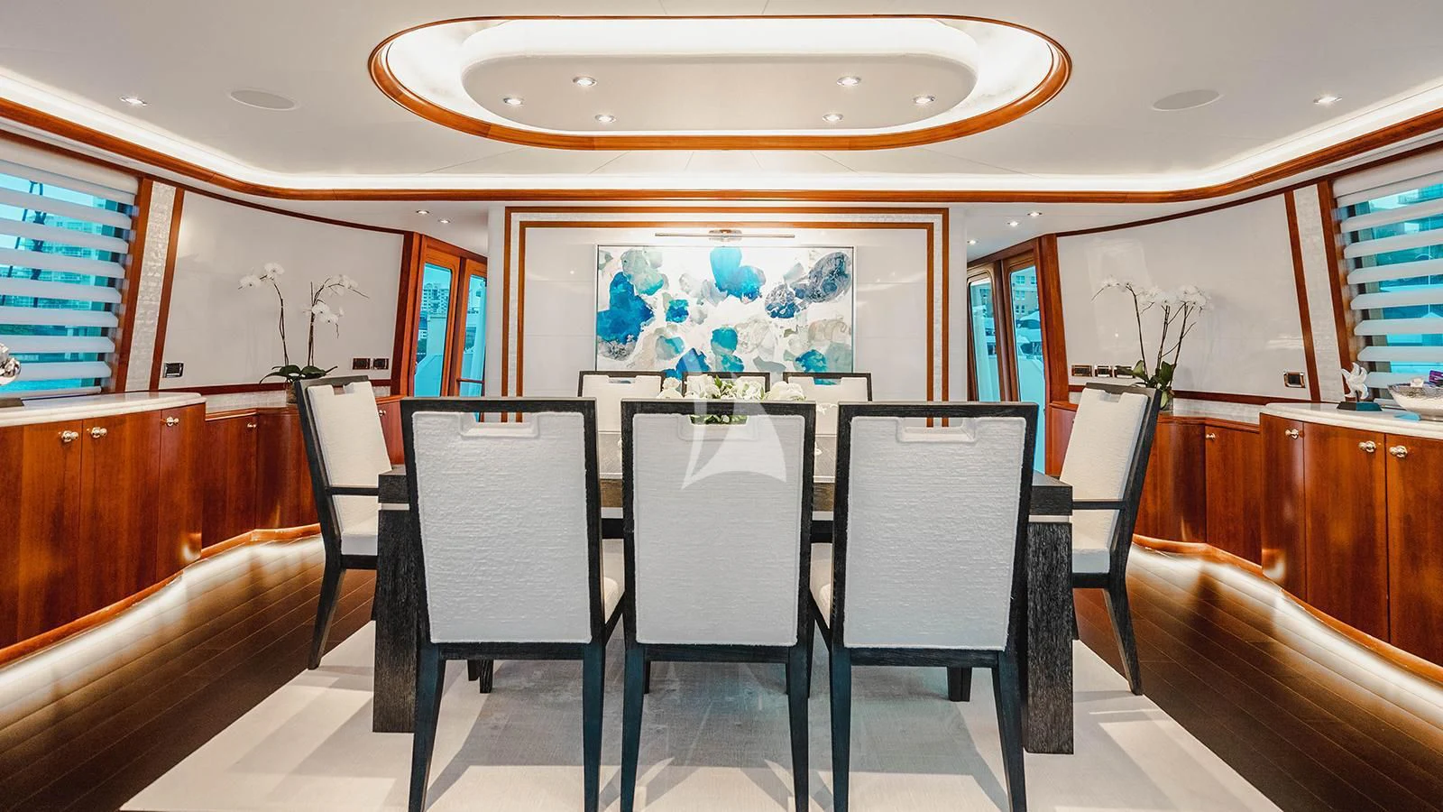 a room with a table and chairs aboard LA LADY Yacht for Sale