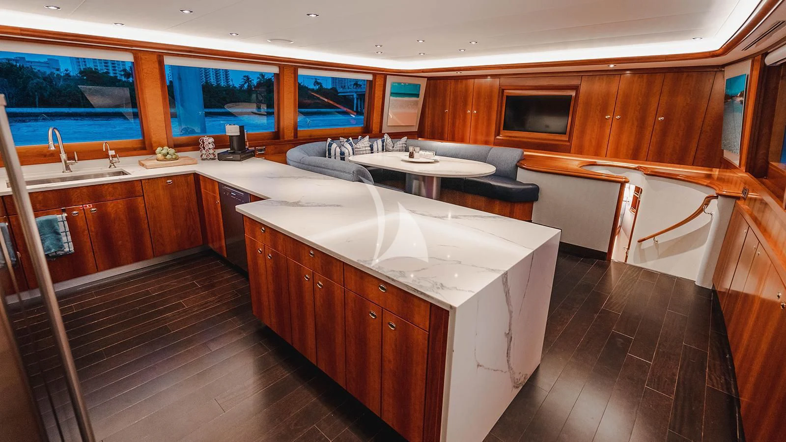 a large kitchen with wooden cabinets aboard LA LADY Yacht for Sale