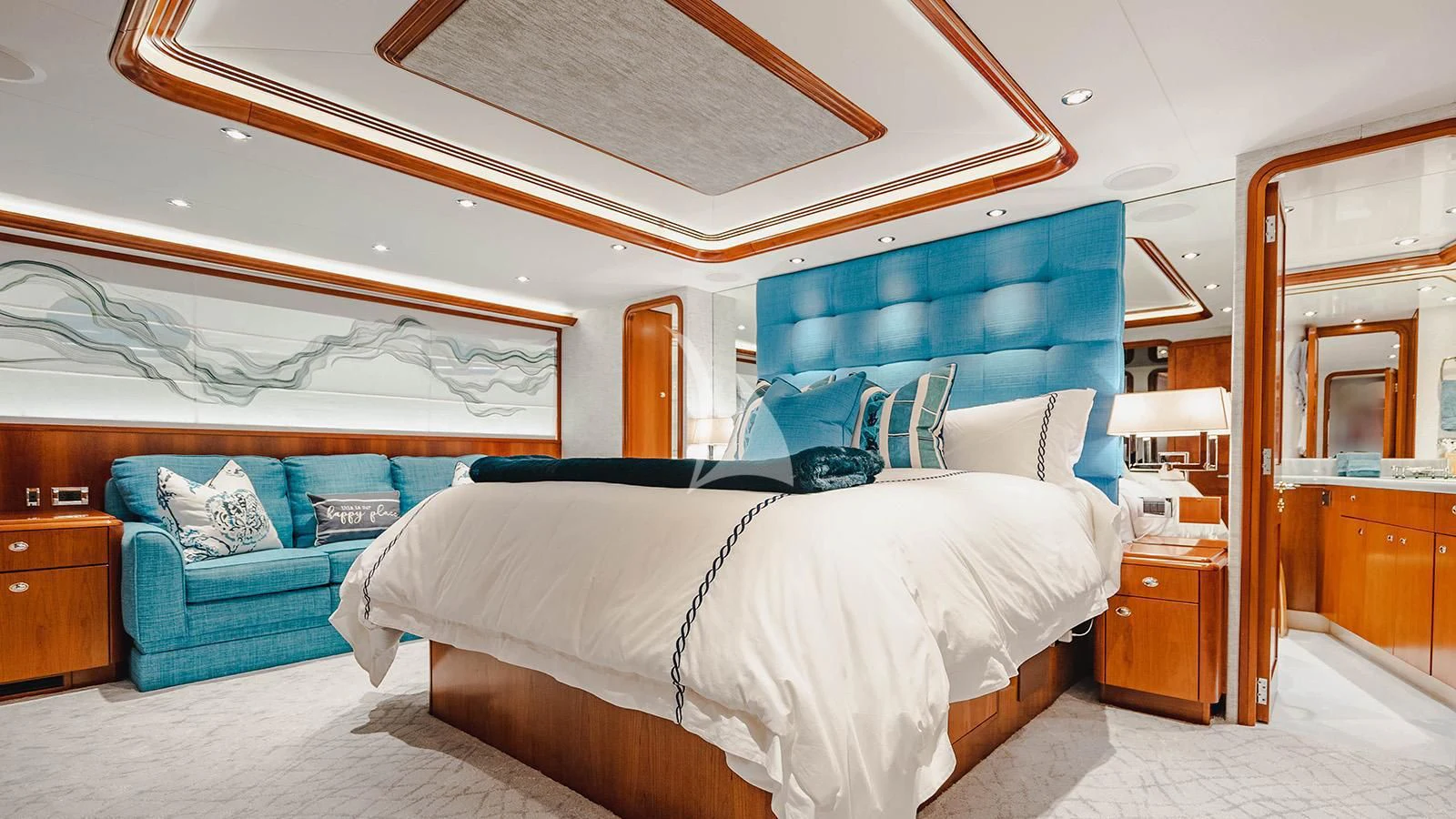 a bedroom with a bed and a couch aboard LA LADY Yacht for Sale
