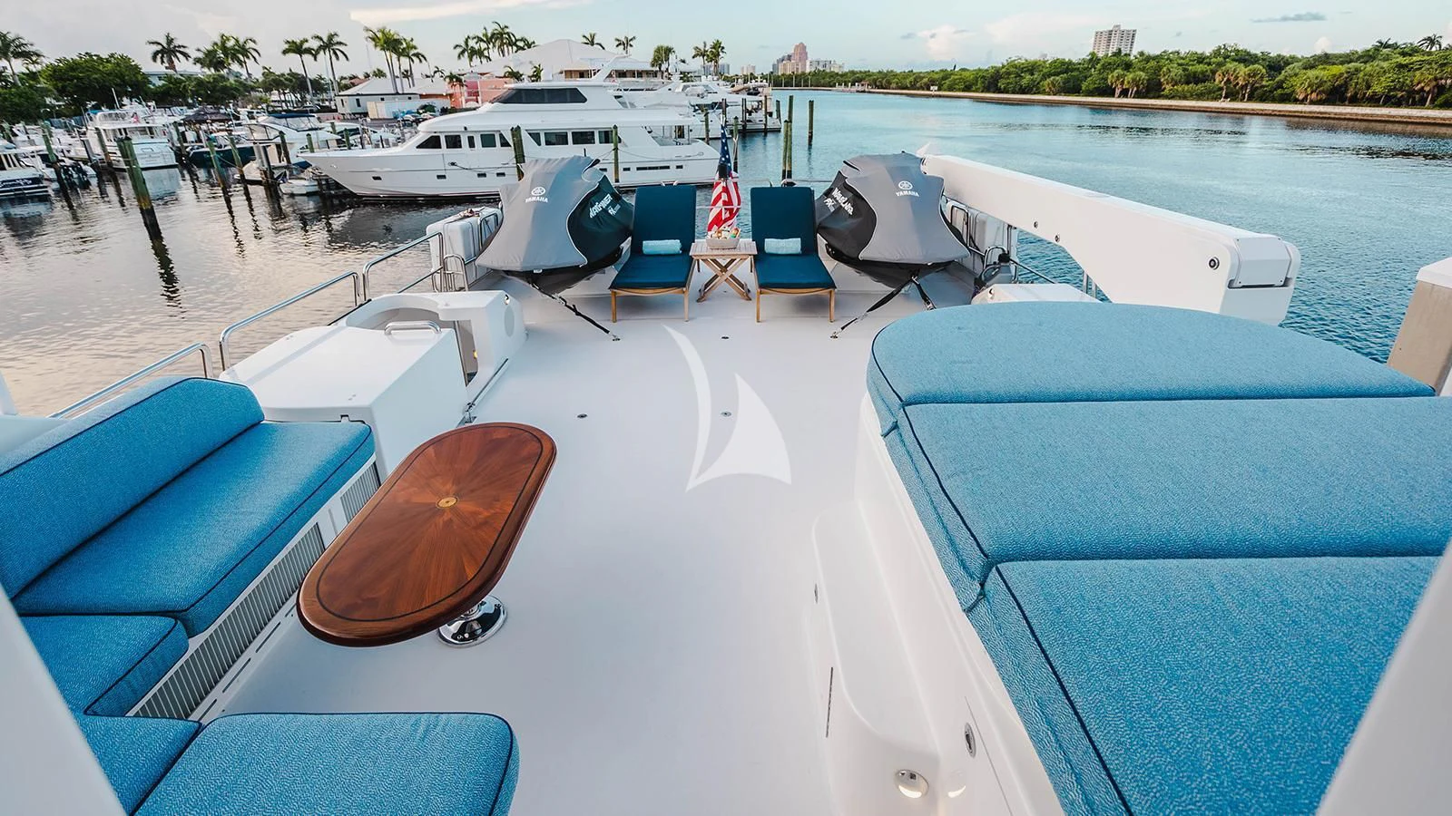 a boat dock with chairs and tables aboard LA LADY Yacht for Sale