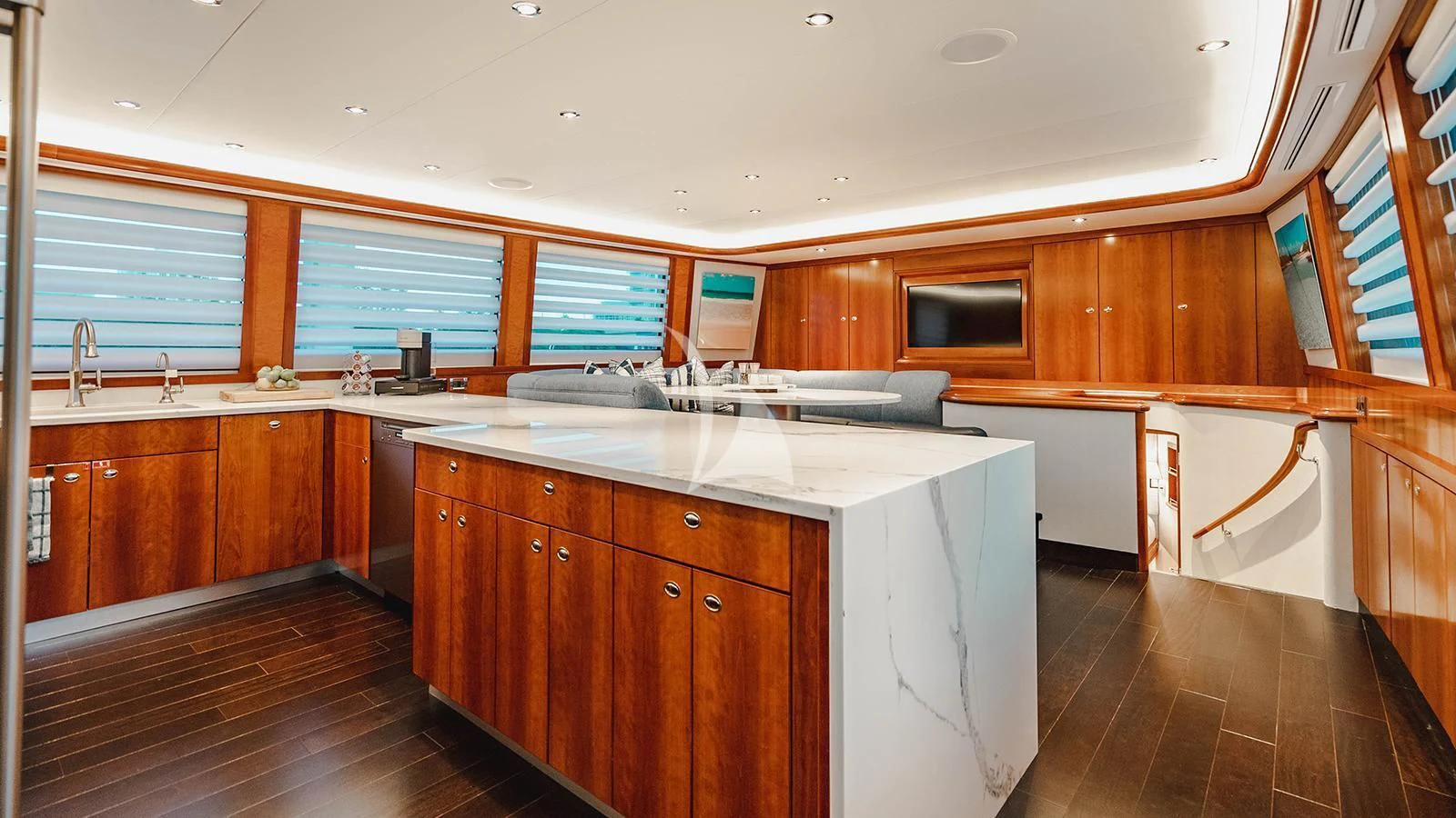 a kitchen with wooden cabinets aboard LA LADY Yacht for Sale