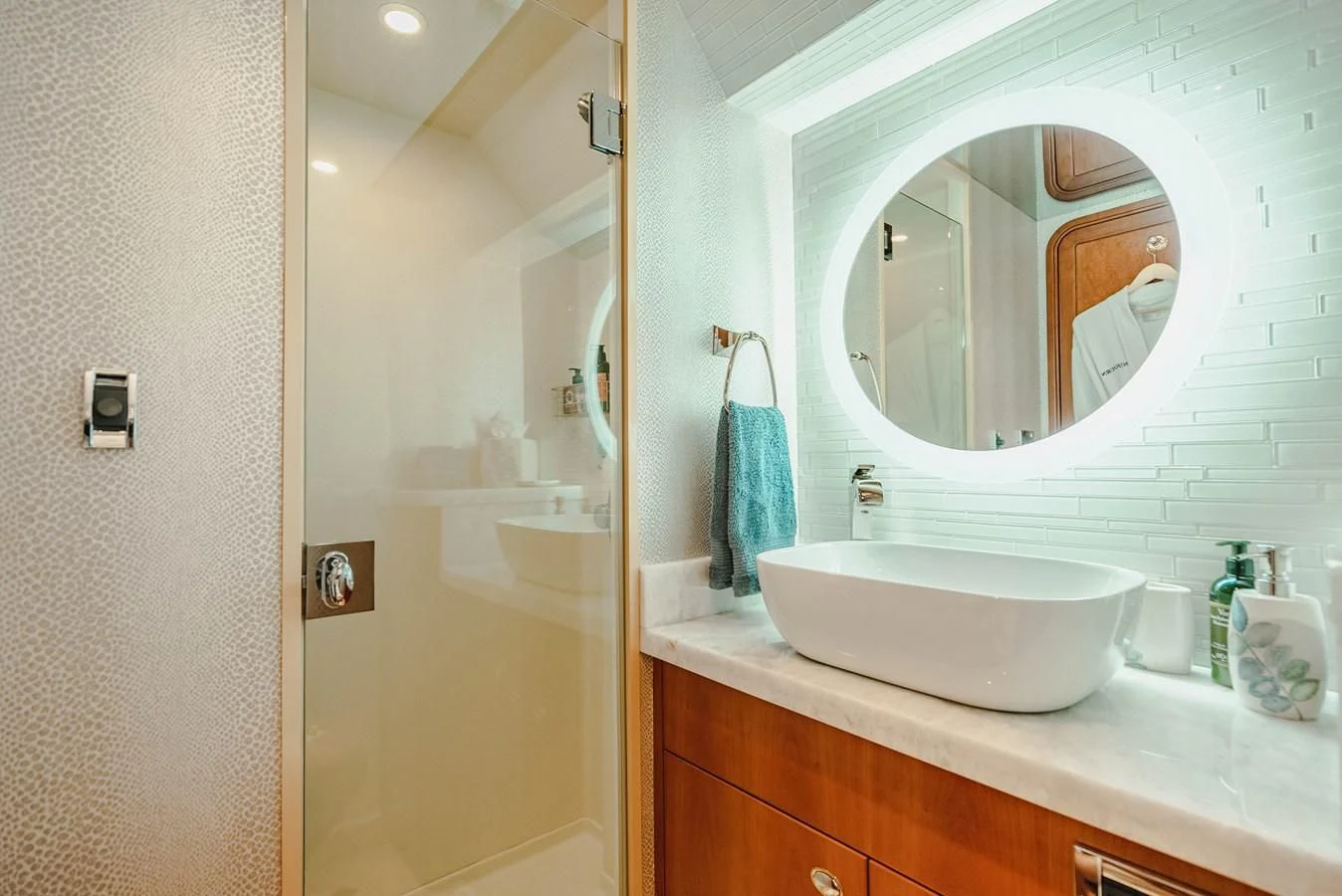 a bathroom with a large mirror aboard LA LADY Yacht for Sale