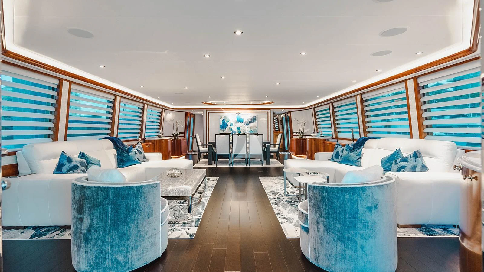 a room with a couch and a table and chairs aboard LA LADY Yacht for Sale