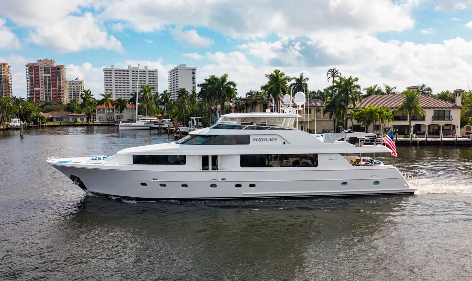 a white yacht on the water aboard LA LADY Yacht for Sale