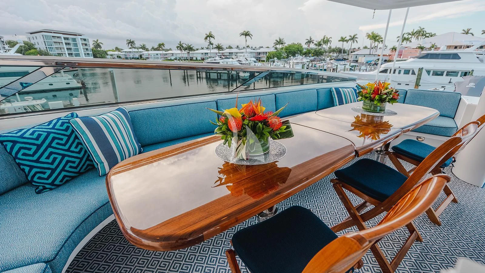 a table with flowers on it aboard LA LADY Yacht for Sale