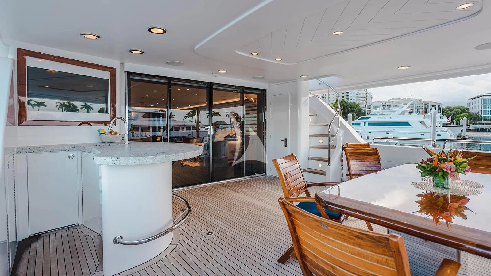 a room with a table and chairs aboard LA LADY Yacht for Sale