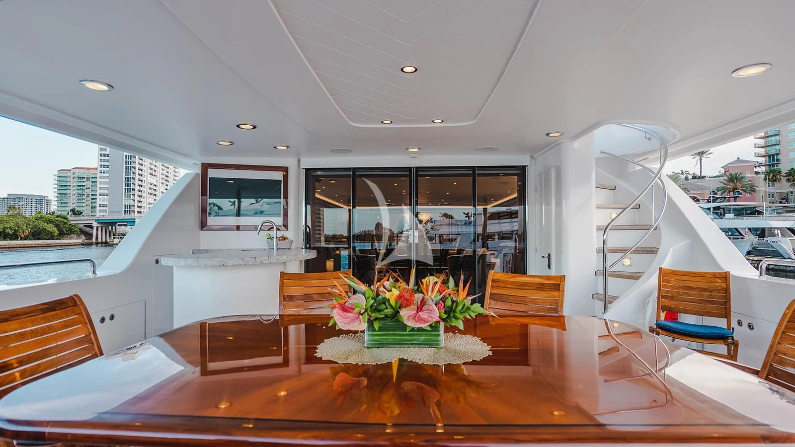 a room with a table and chairs aboard LA LADY Yacht for Sale