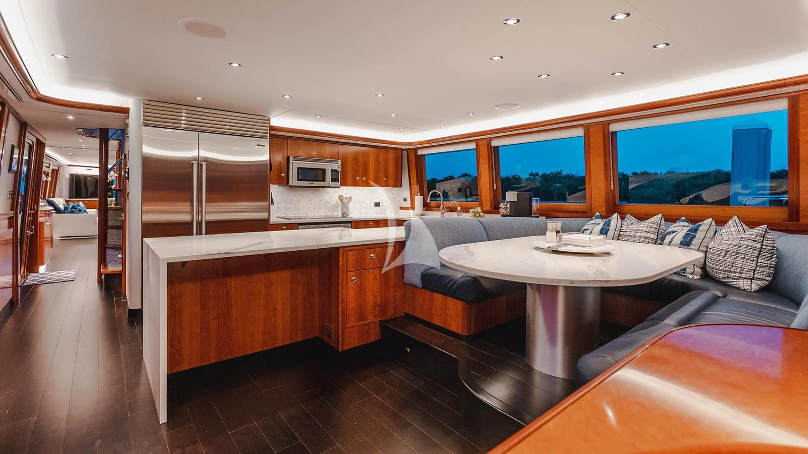 a living room with a table and couches aboard LA LADY Yacht for Sale
