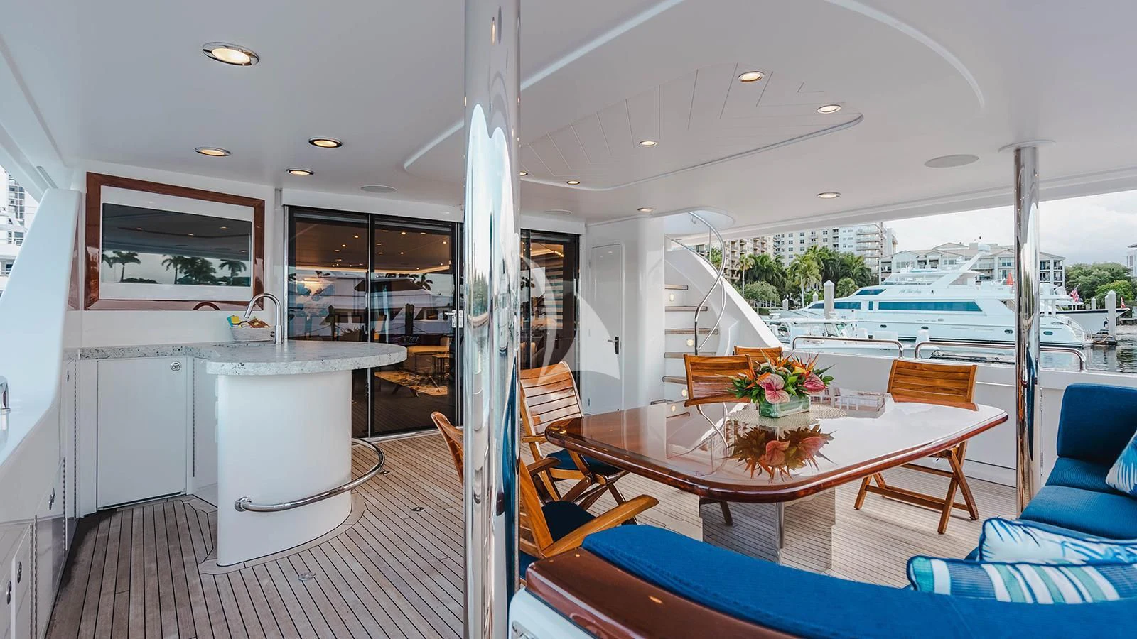 a room with a table and chairs aboard LA LADY Yacht for Sale