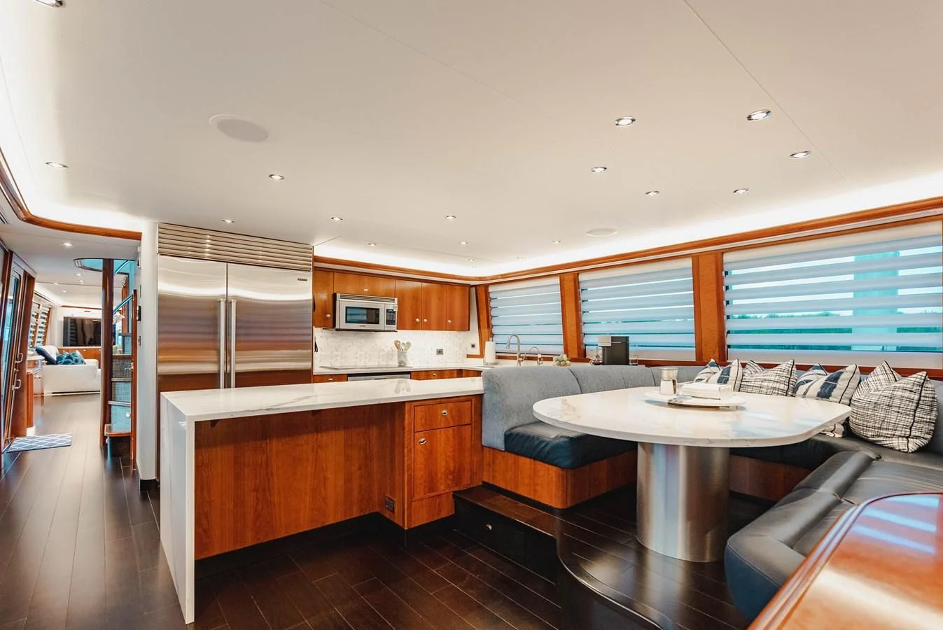 a large kitchen with a table aboard LA LADY Yacht for Sale