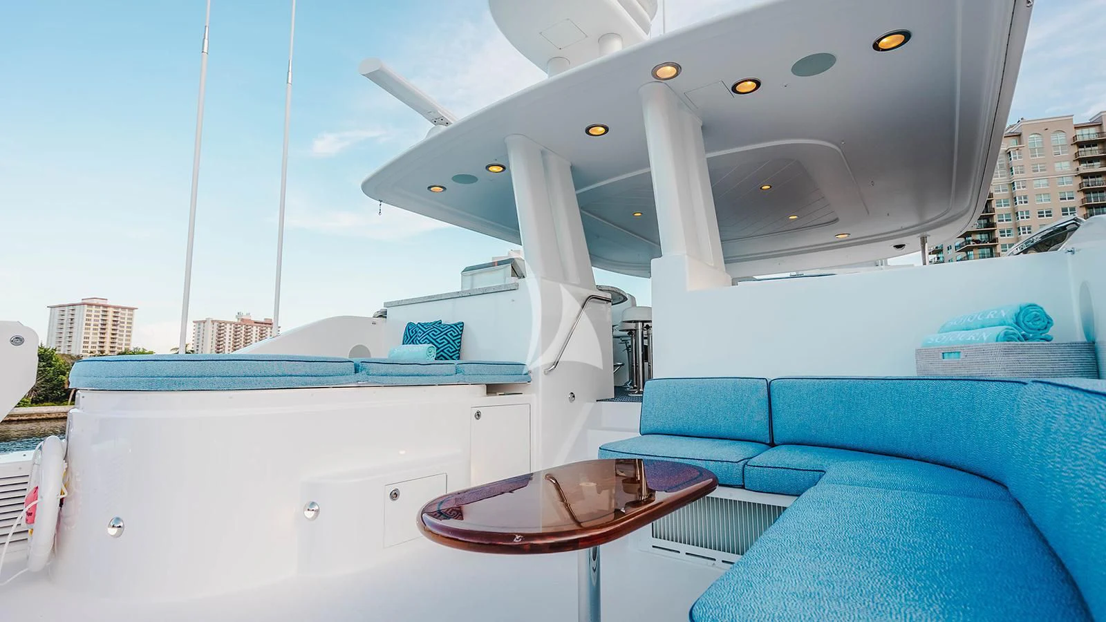 a boat with a table and chairs aboard LA LADY Yacht for Sale
