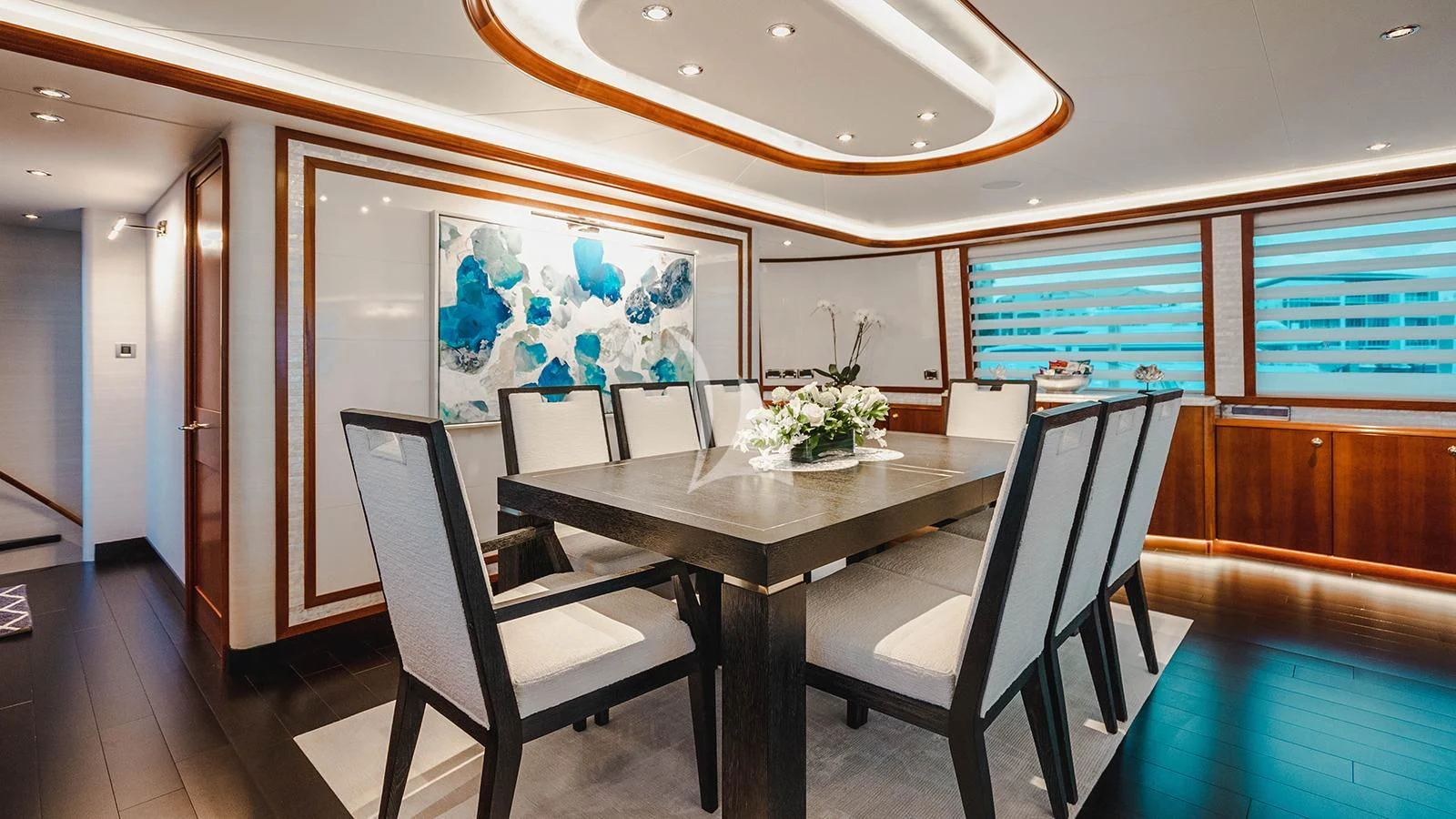 a room with a table and chairs aboard LA LADY Yacht for Sale