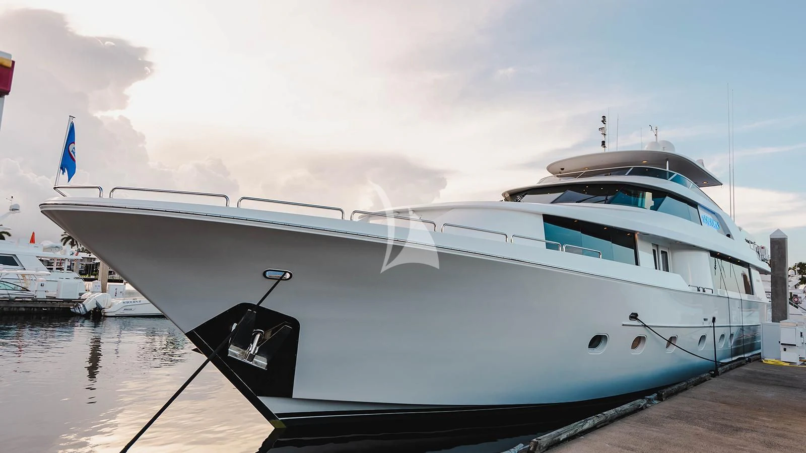 a white yacht docked aboard LA LADY Yacht for Sale