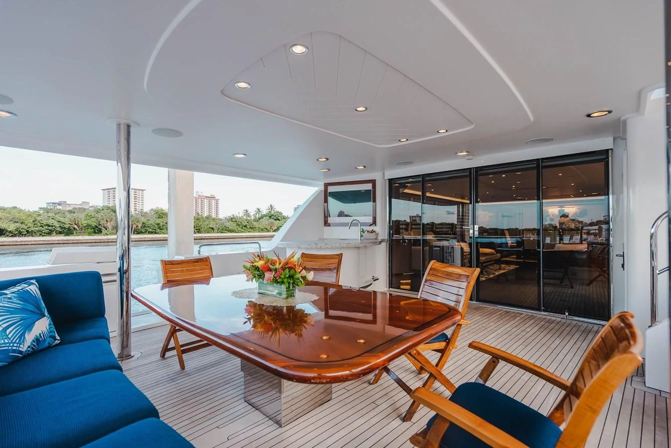 a large open living room with a large table and chairs aboard LA LADY Yacht for Sale