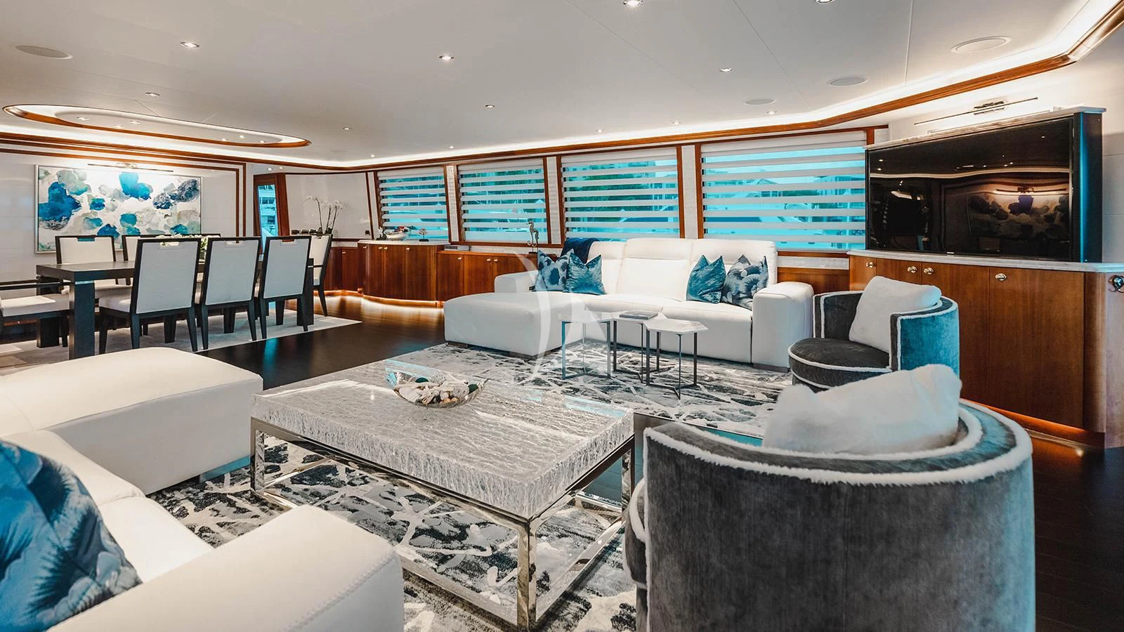 a room with a table and chairs aboard LA LADY Yacht for Sale
