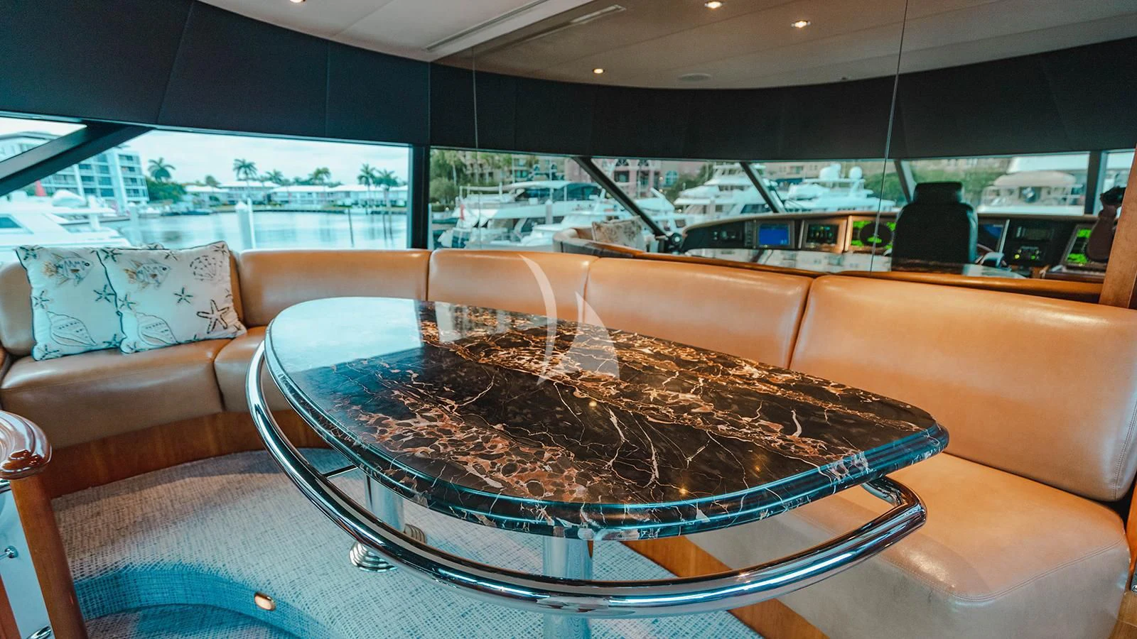 a large glass bowl on a table aboard LA LADY Yacht for Sale