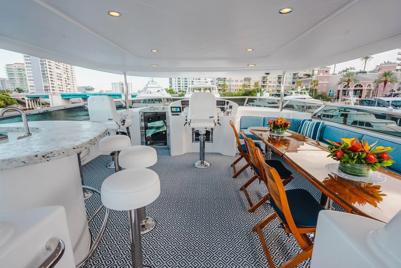 a room with tables chairs and a pool aboard LA LADY Yacht for Sale