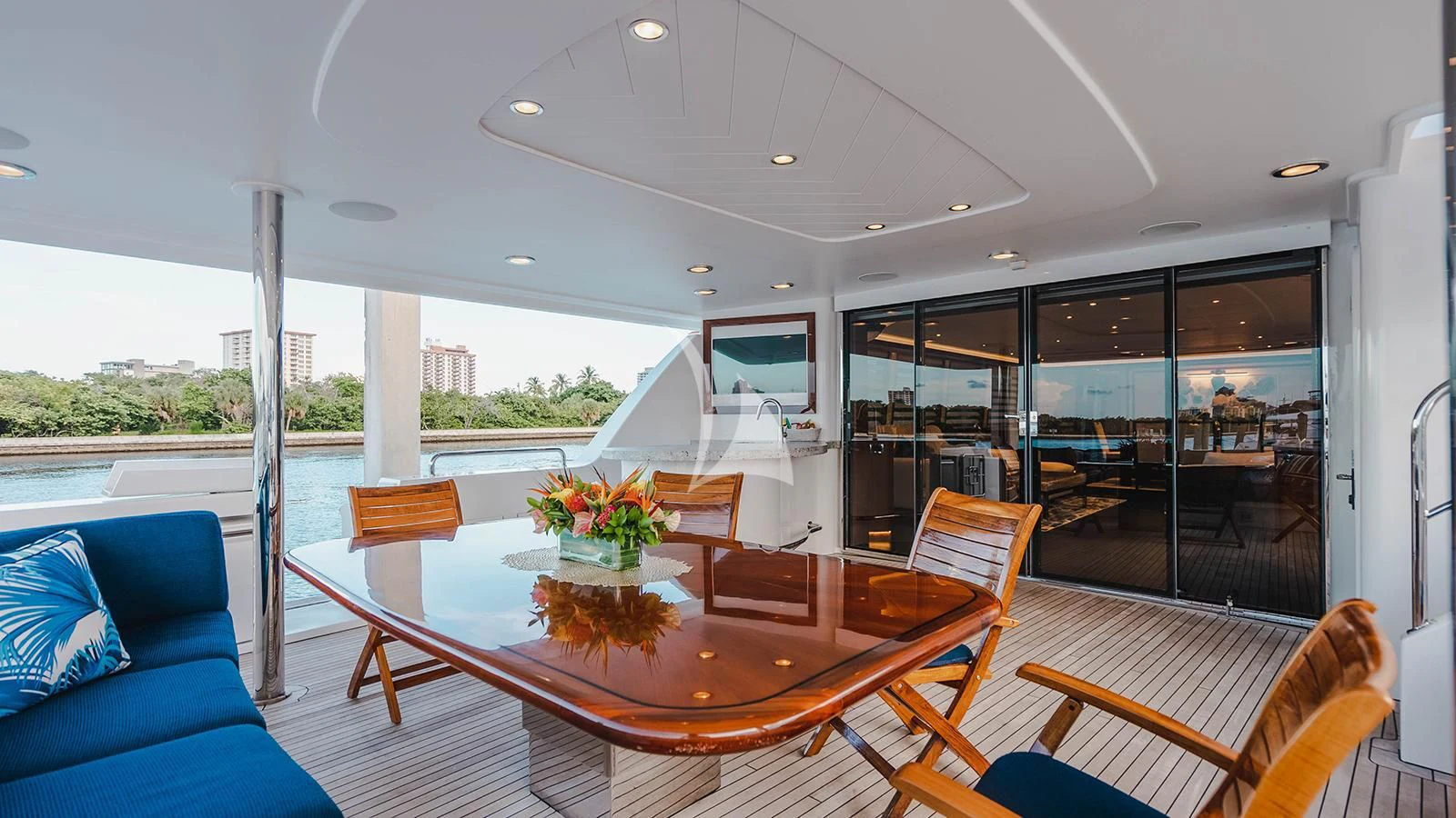 a large dining table in a room aboard LA LADY Yacht for Sale