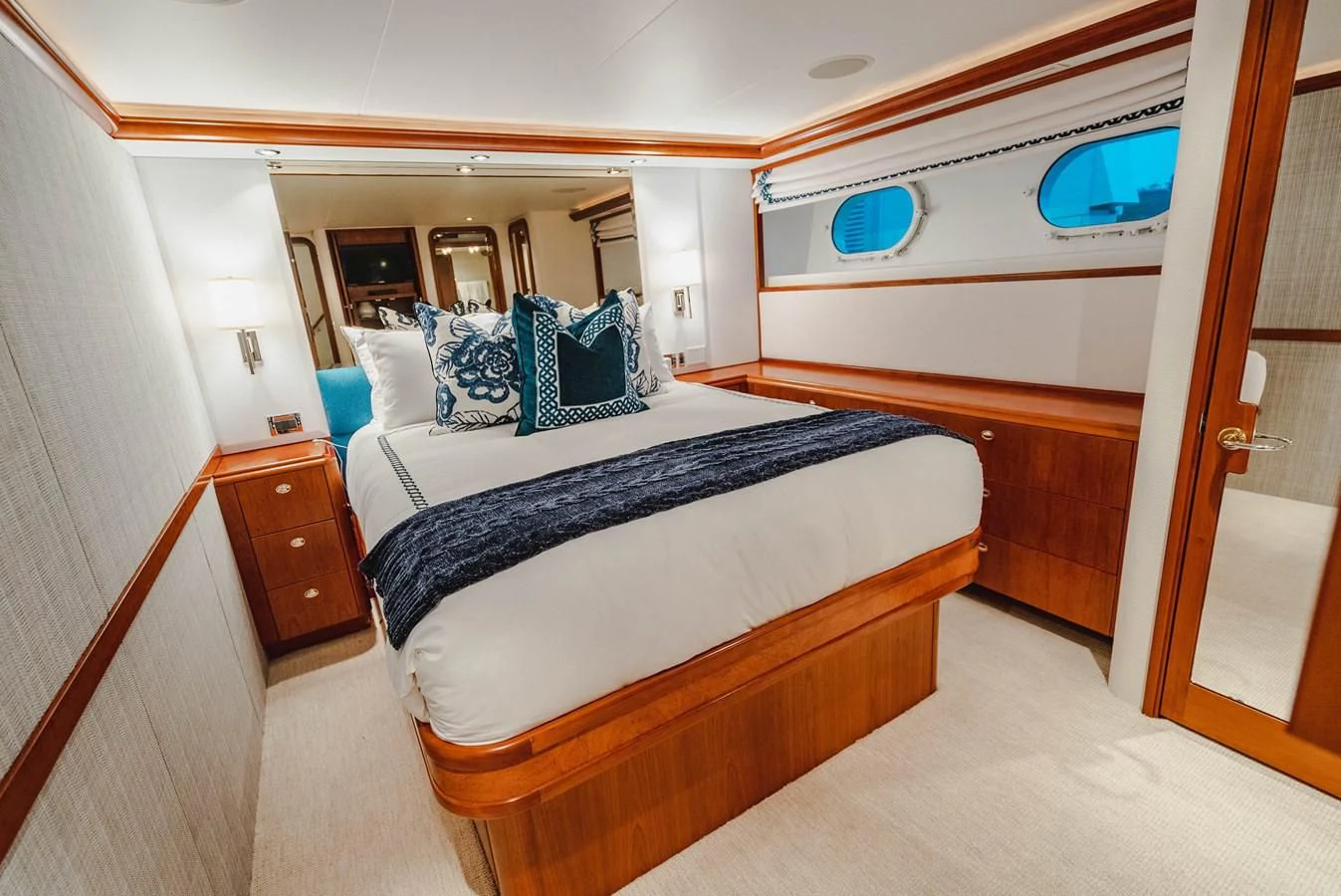 a room with a bed and a mirror aboard LA LADY Yacht for Sale