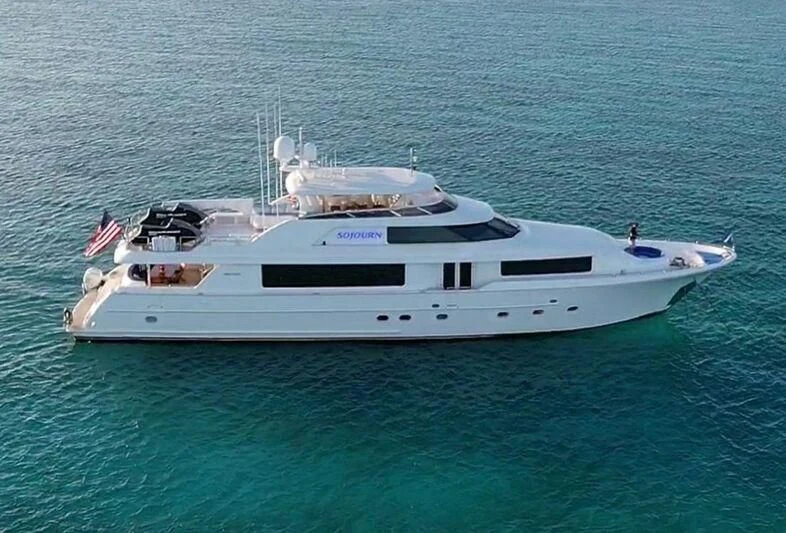 a white yacht in the ocean aboard LA LADY Yacht for Sale