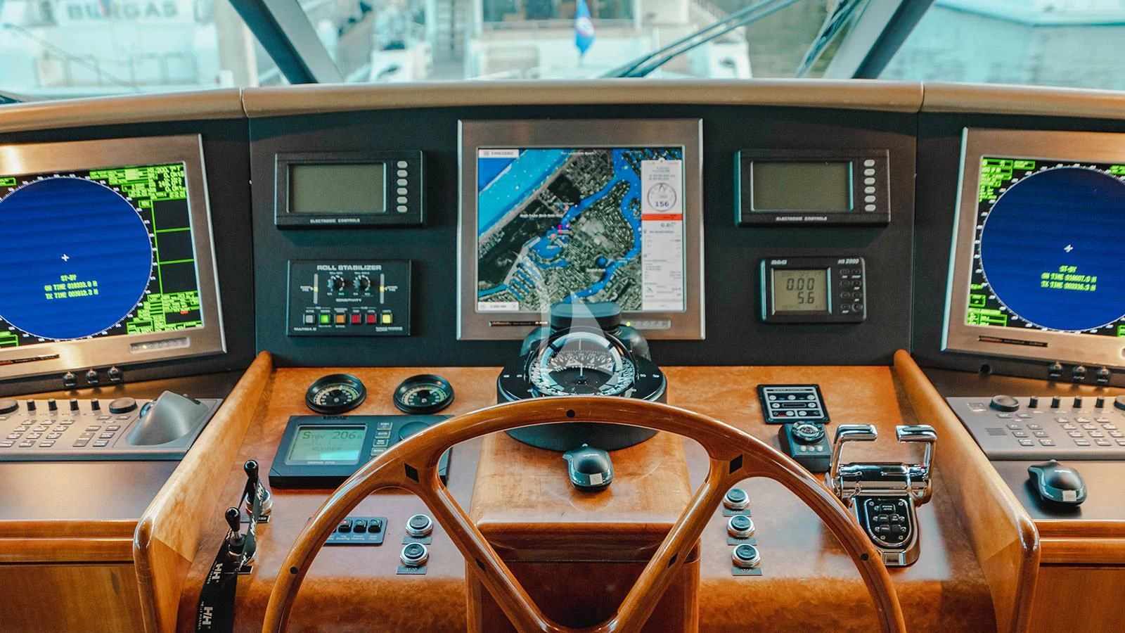 a control panel with a screen and buttons aboard LA LADY Yacht for Sale