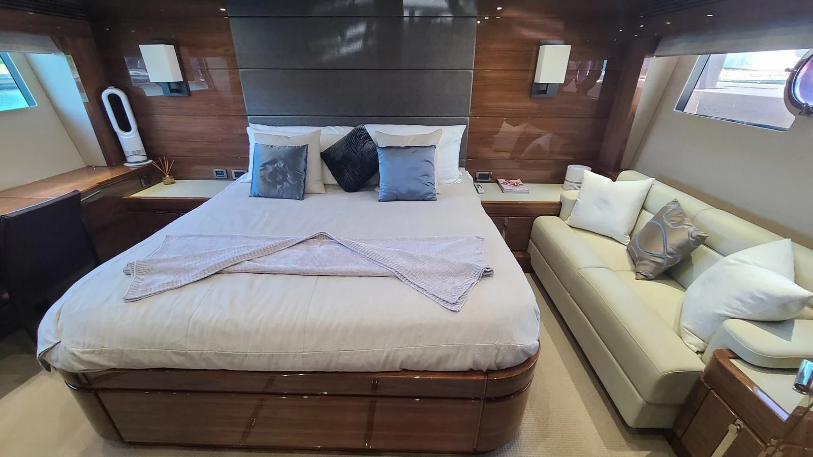a room with a bed and a couch aboard PREDATOR 68 Yacht for Sale