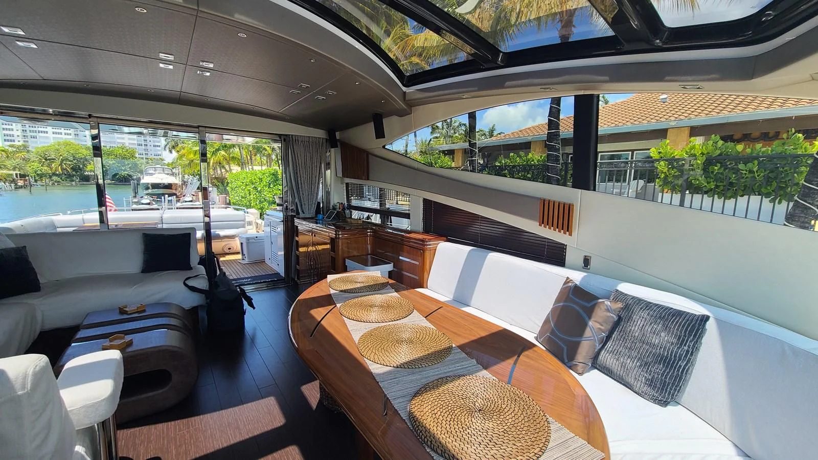 a room with a table and chairs aboard PREDATOR 68 Yacht for Sale