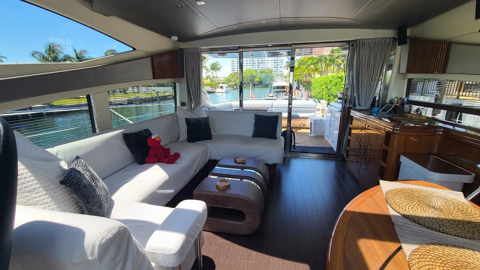 a living room with a large window aboard PREDATOR 68 Yacht for Sale