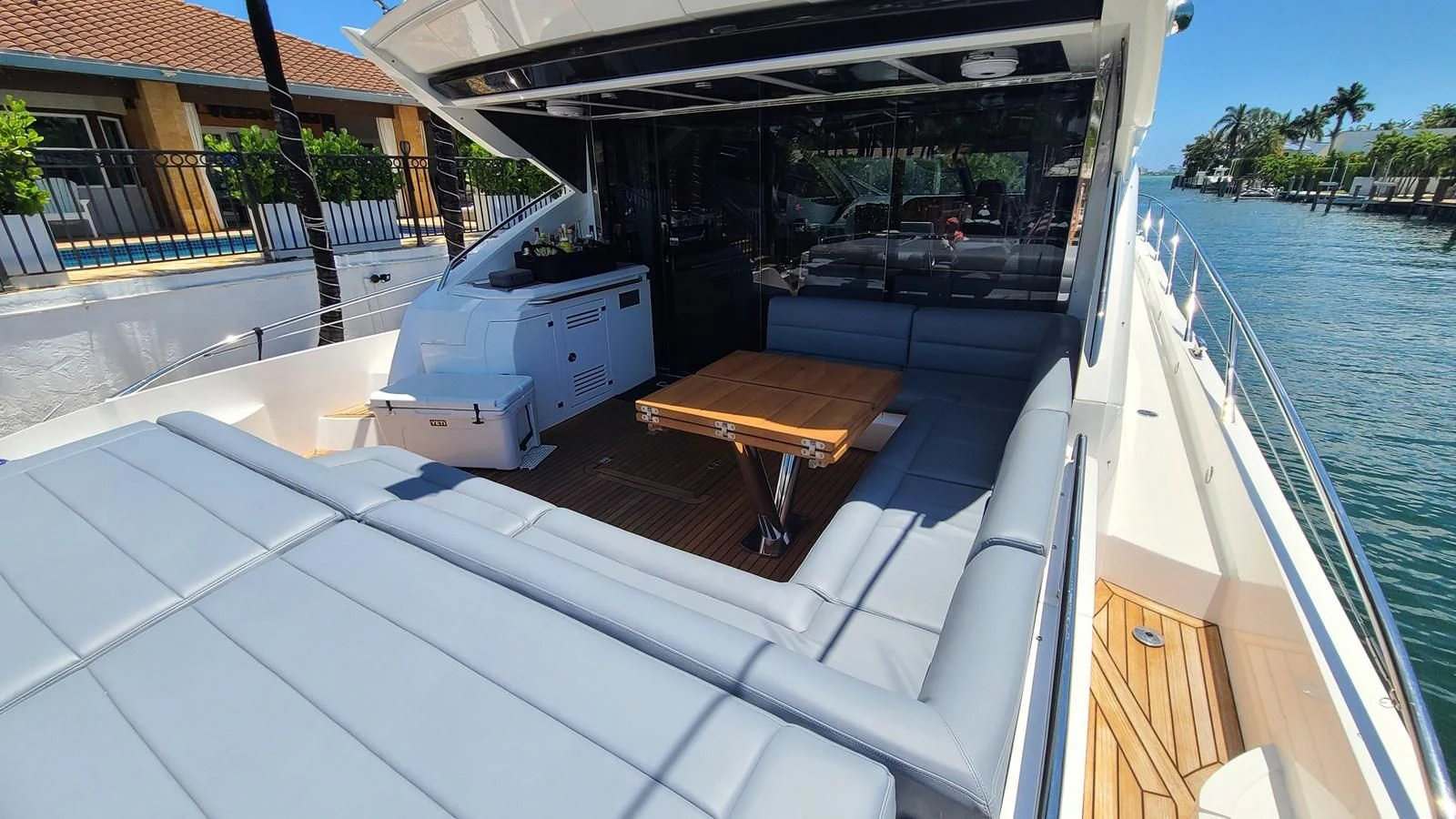 a deck with a boat and a bench on it aboard PREDATOR 68 Yacht for Sale