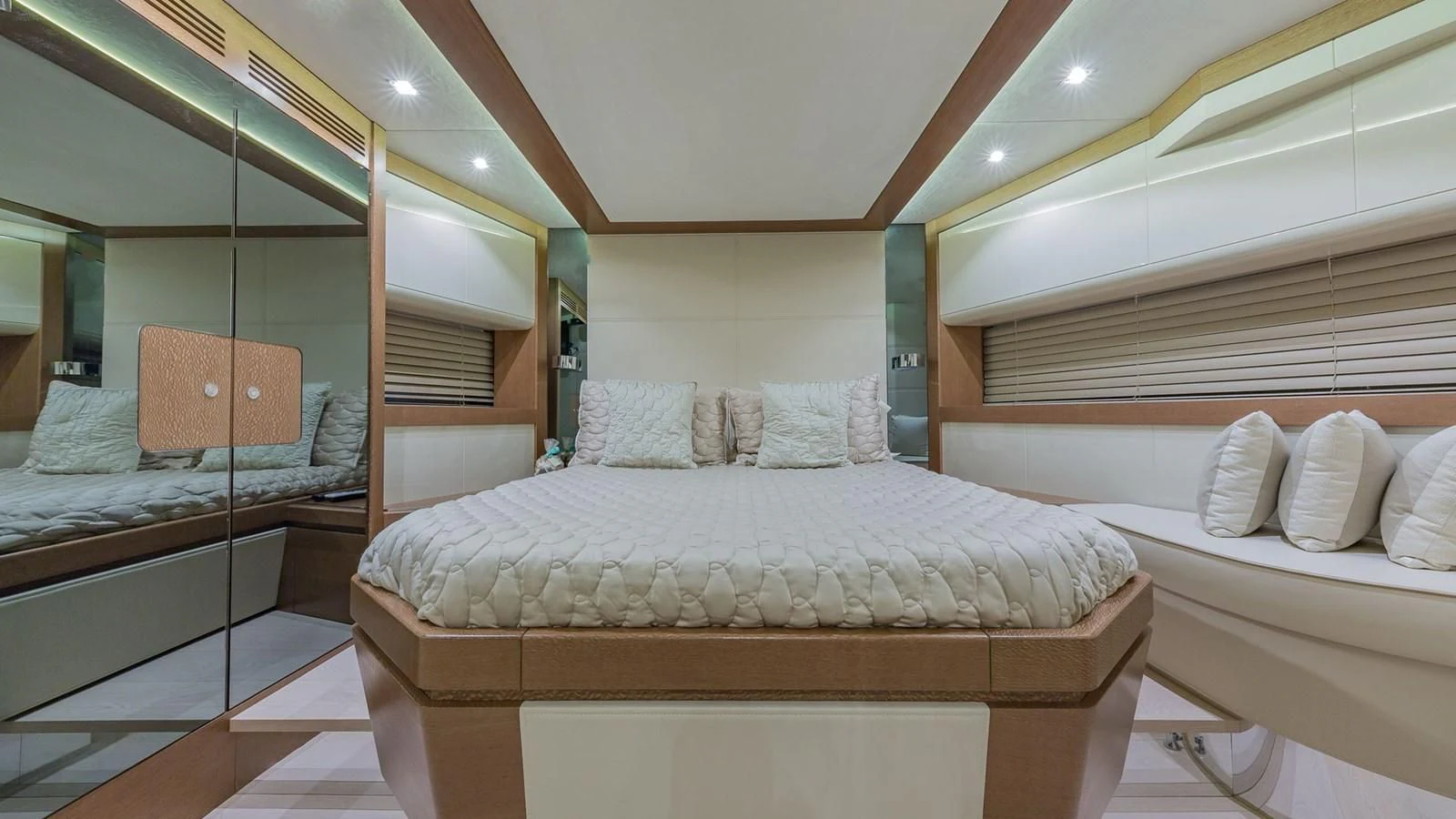 a room with a bed and a mirror aboard GOLDEN 3 Yacht for Sale
