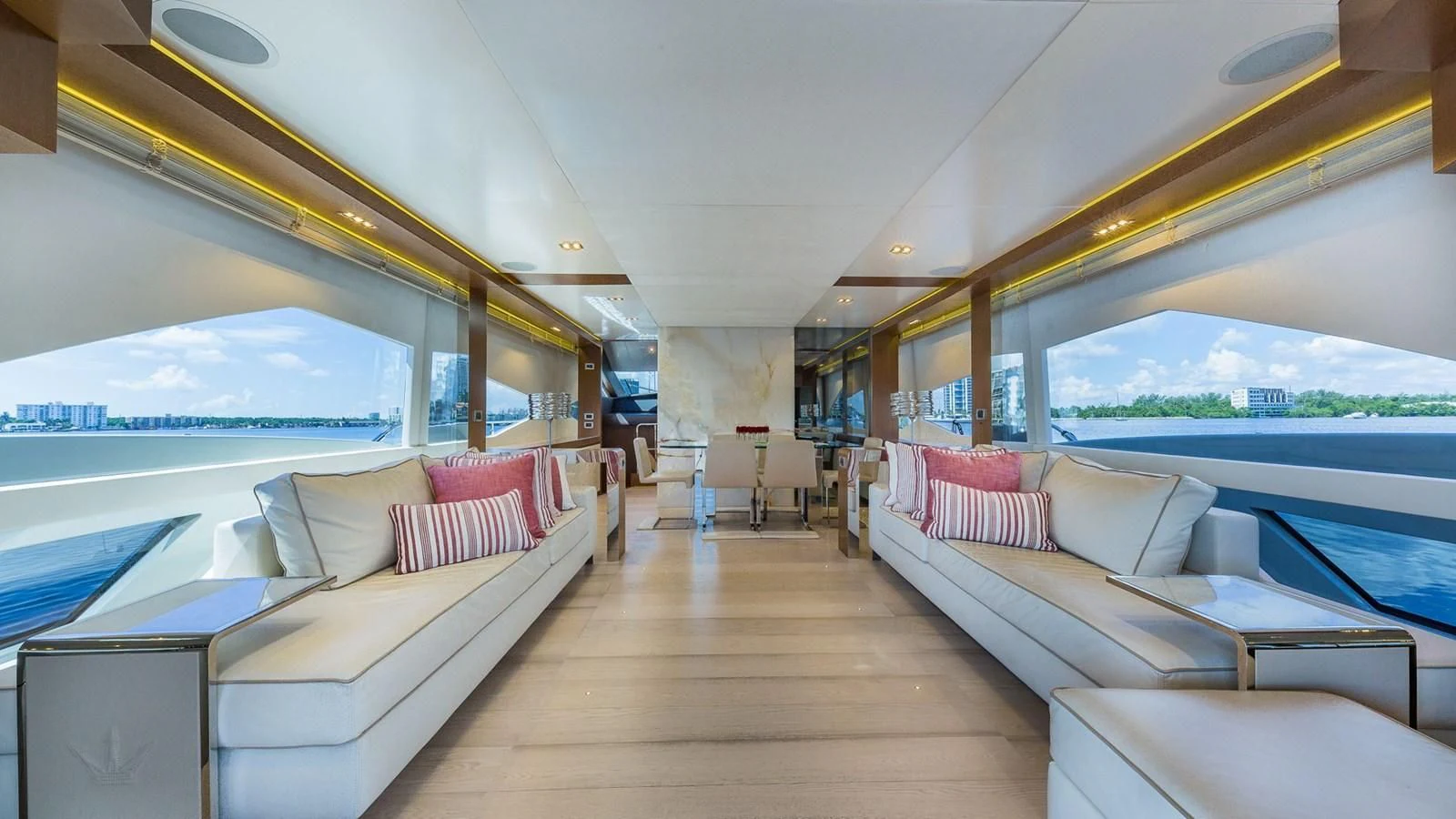 a room with a couch and a large window aboard GOLDEN 3 Yacht for Sale