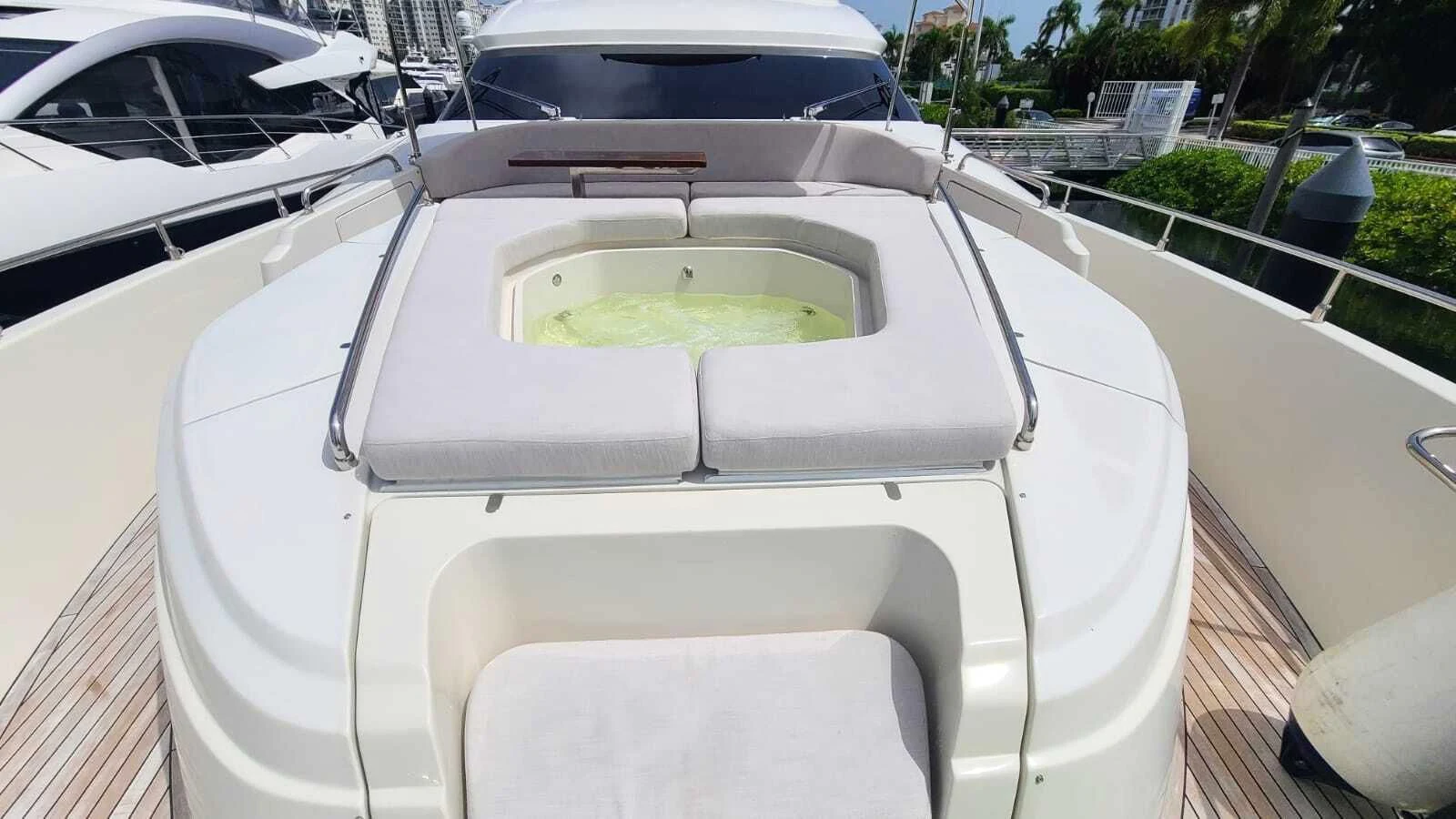 a white car with a green substance on the hood aboard GOLDEN 3 Yacht for Sale