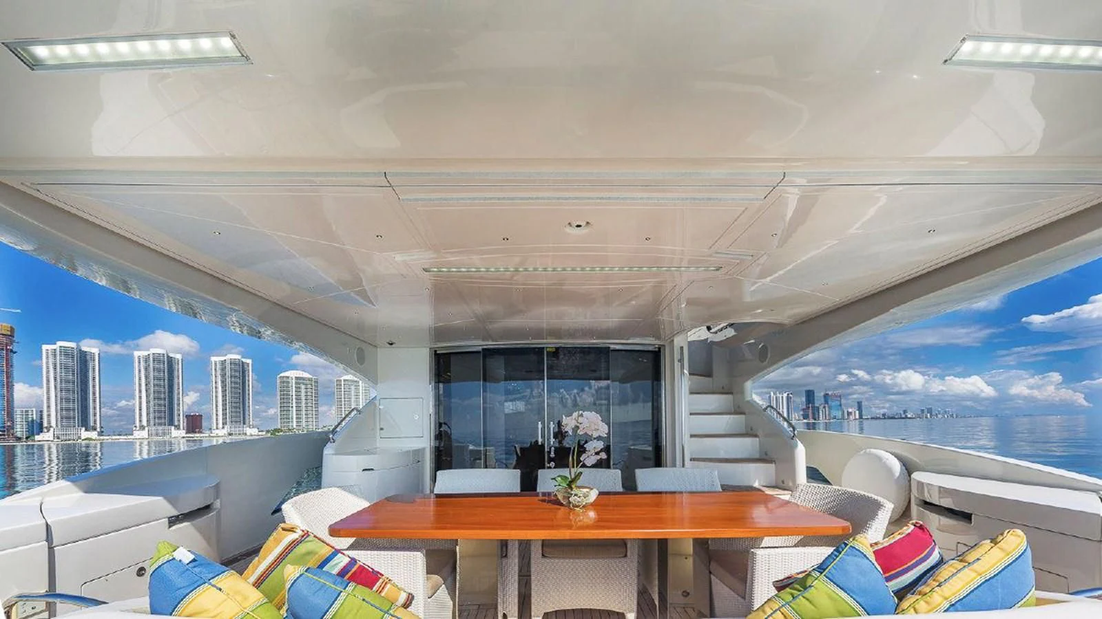 a room with a table and chairs aboard GOLDEN 3 Yacht for Sale